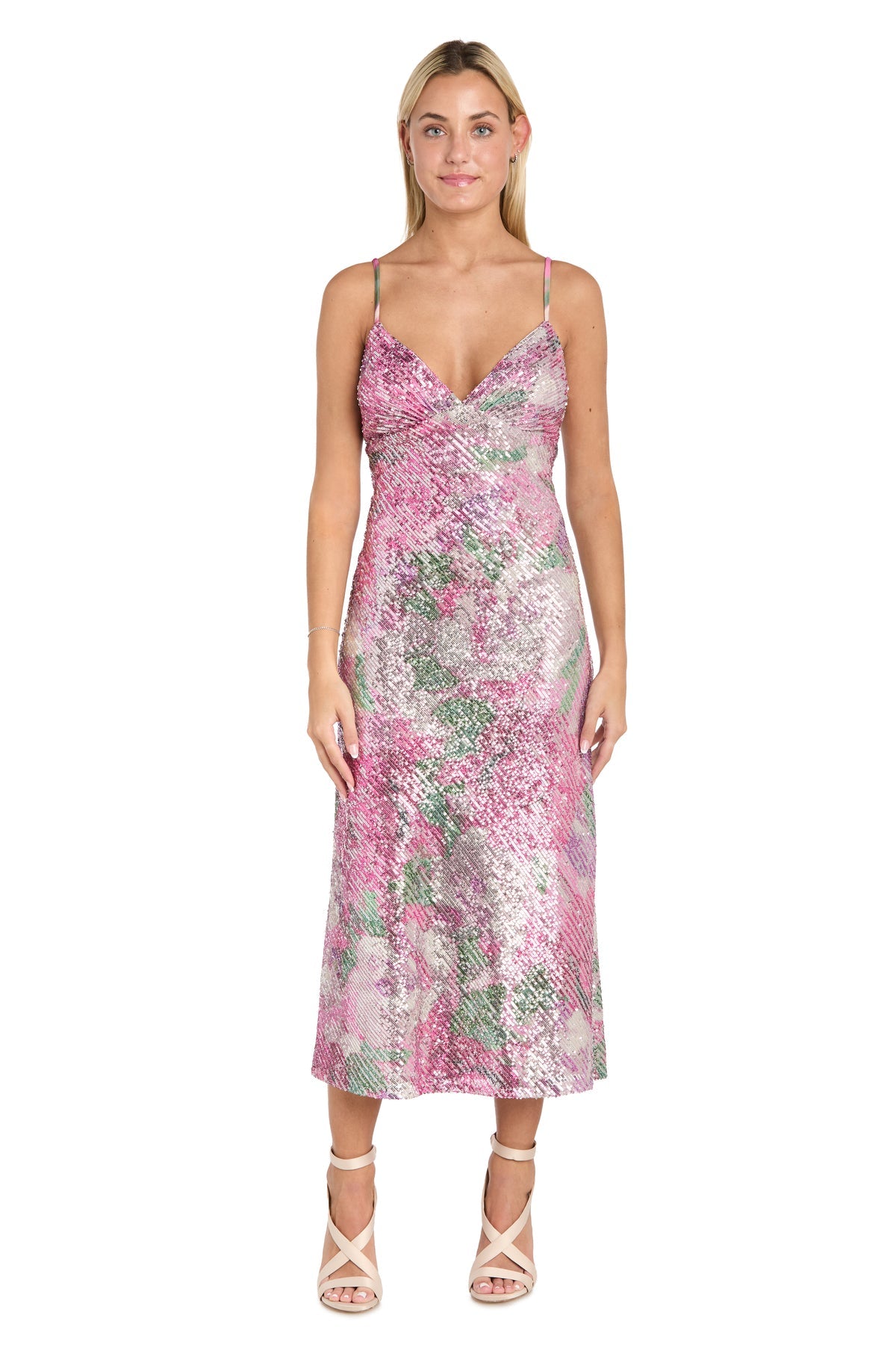 A woman stands facing forward against a white background, wearing the Morgan 10253 Semi-Formal Floral Sequin Dress—sleeveless, tea-length with thin straps—and light-colored strappy heels.